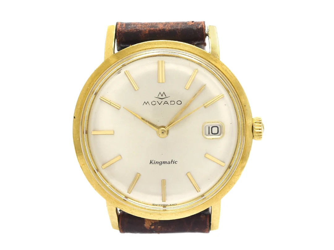 MOVADO,Kingmatic, Cal 538, Boett nr. 375 / 5261, herrur, 34 mm, 18K guld, automatisk, plexiglas, datum, skadad urtavla, defekt, skadad boett, läderband, ca 1960. — Klockor/Movado — Kaplans