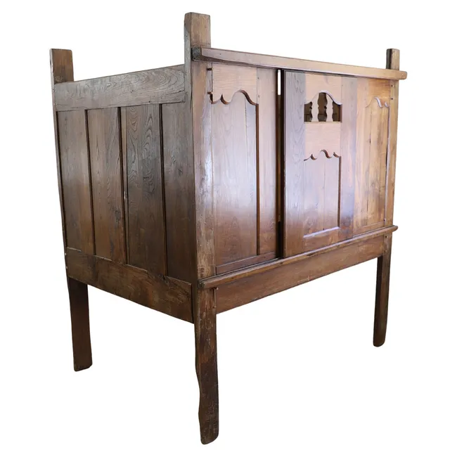 AN ANTIQUE FRENCH BRETON OAK BED.
