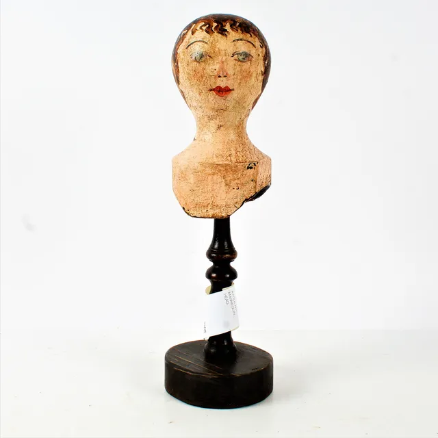 A FOLK ART MANNEQUIN HEAD.
