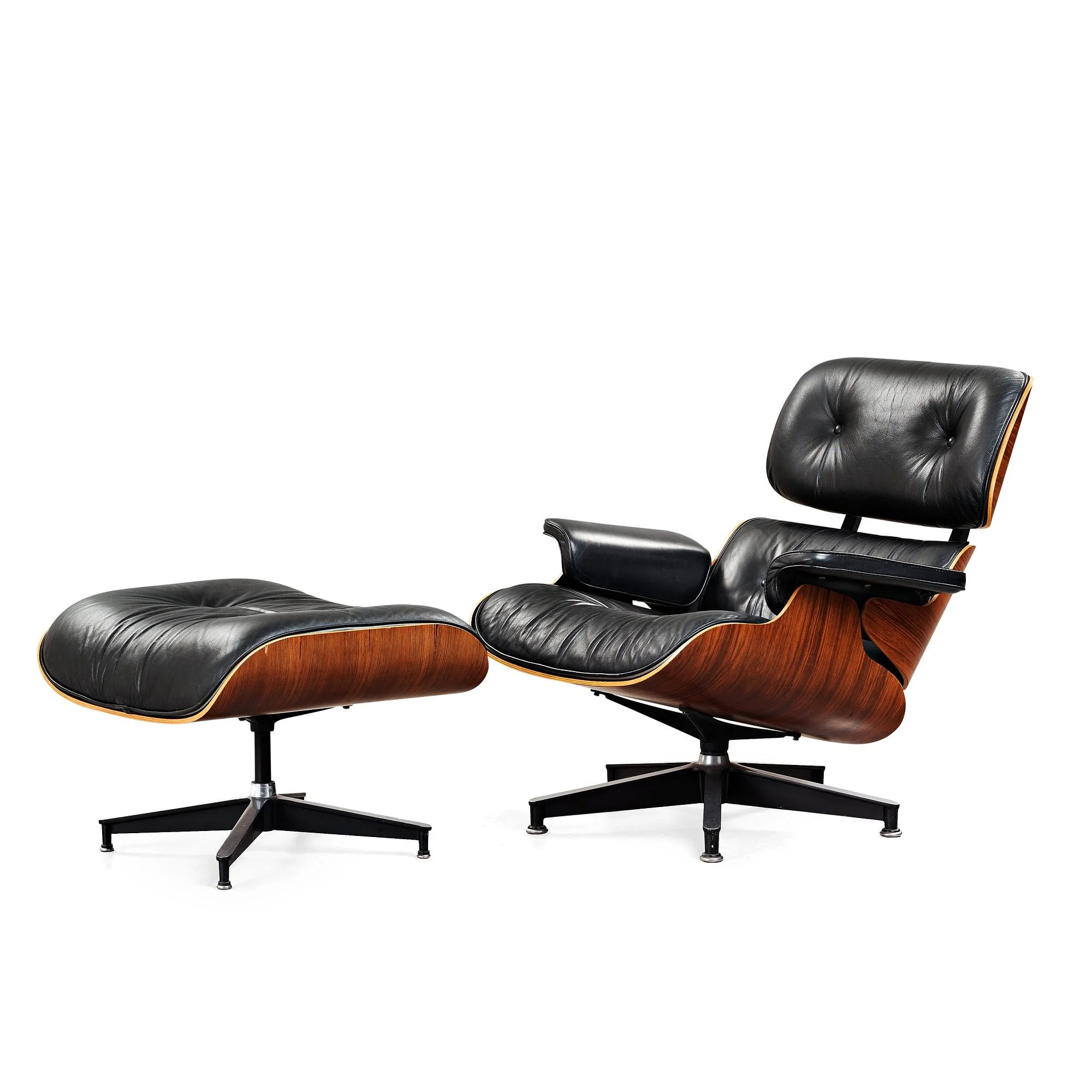 Charles & Ray Eames, fåtölj med fotpall, Herman Miller, USA 1980-tal. — Bukowskis