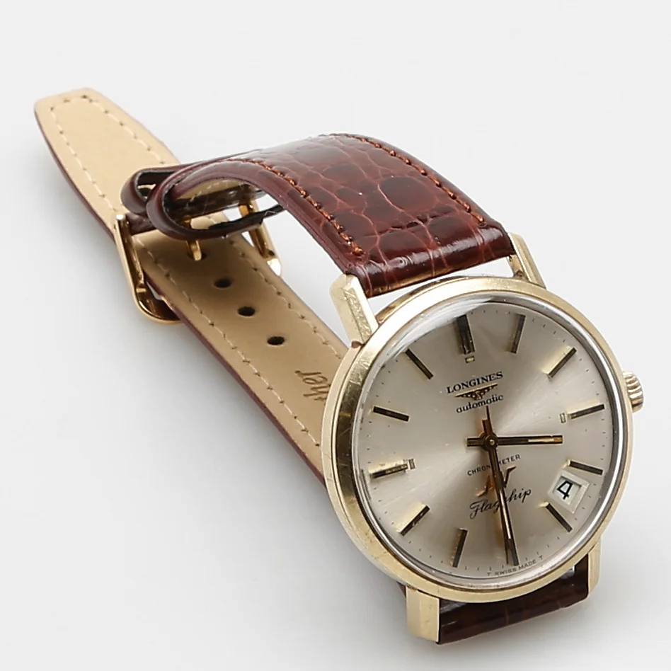 HERRARMBANDSUR, LONGINES FLAGSHIP, guld på stål. — Wristwatches — Garpenhus Auktioner