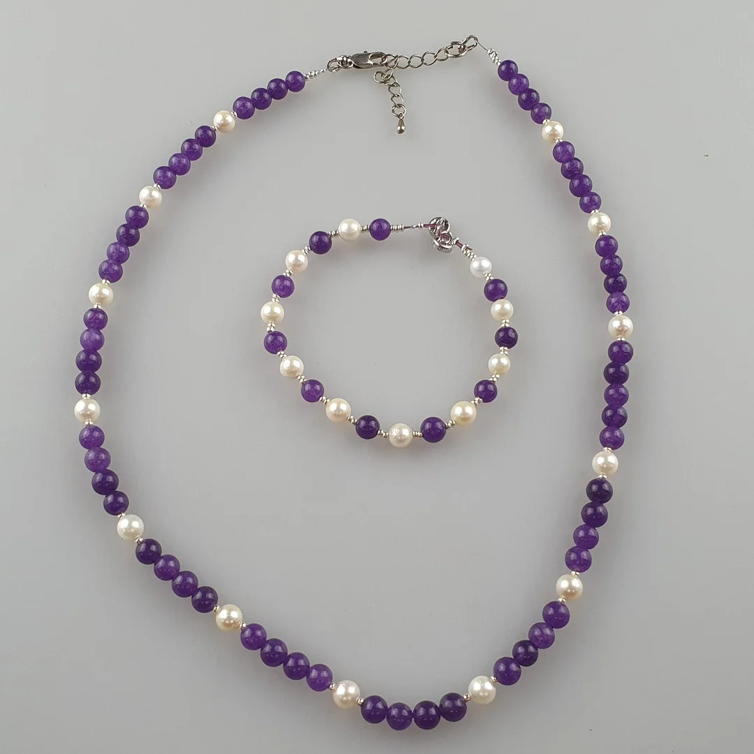 - HALSKETTE & ARMBAND mit Amethystperlen. — Jewellery Suites — Auktionshaus Blank