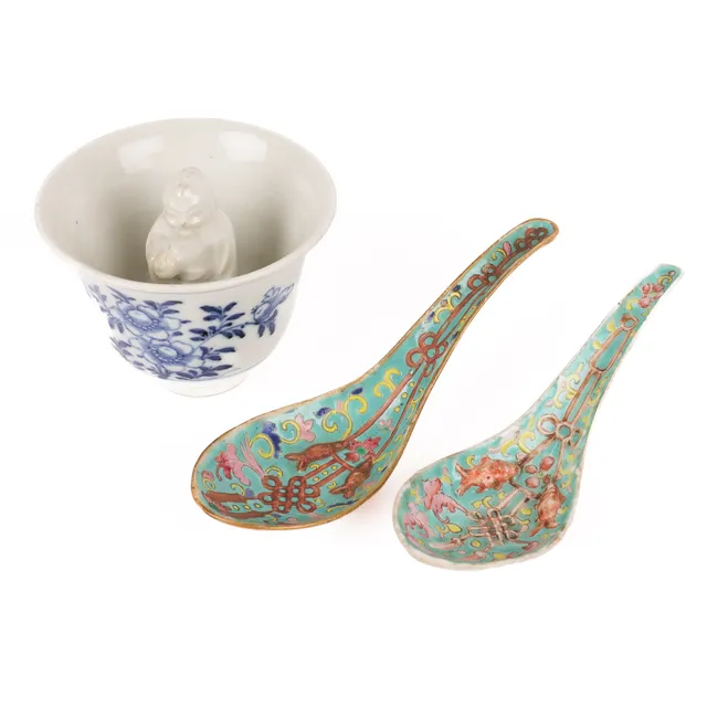 Chinese 'Trick' cup and a pair of spoons, richly decorated in enamel colours. (3)