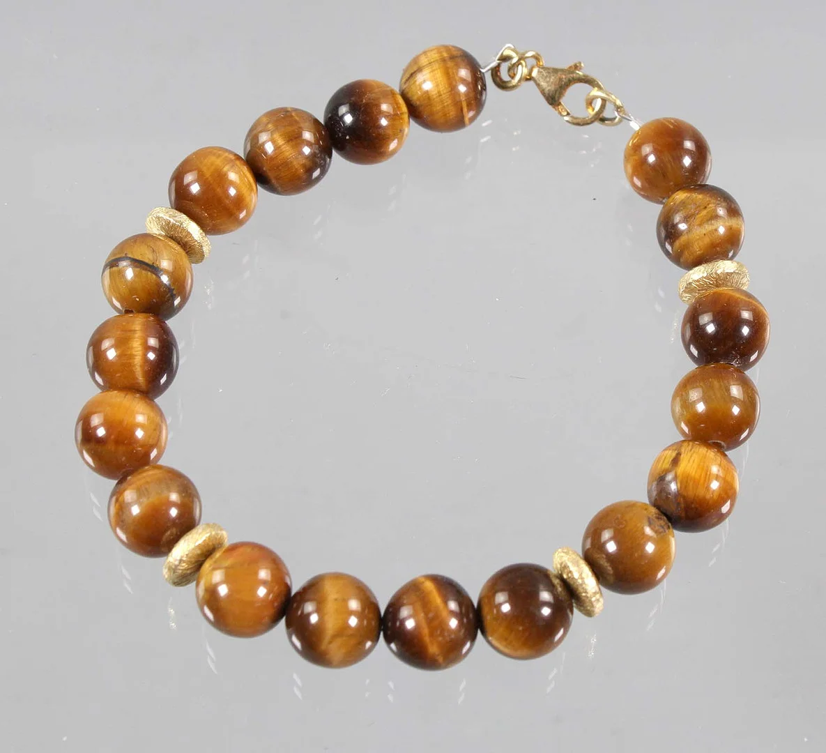TIGERAUGEN ARMBAND, Silber vergoldet. — Bracelets — Auktionshaus Bossard