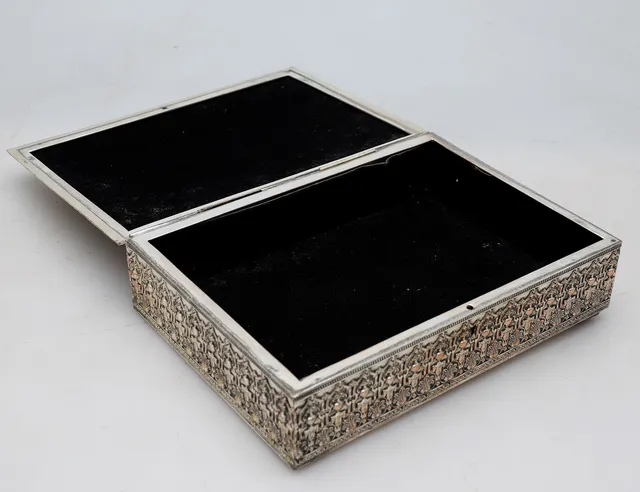 Silvery metal box.