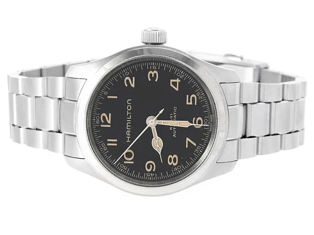 HAMILTON, Khaki Field, "Murph", Cal H10 (ETA C07611), Serie nr. 0L2GS7C0U, Ref nr. H70405130, Boett nr. H704050, herrur, 38 mm, stål, automatisk, safirglas, glasbaksida, originallänk, viklås, cert, juli 2025, box, ytterkartong.