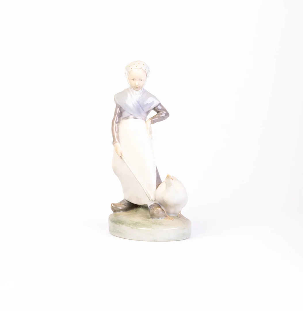 ROYAL COPENHAGEN GIRL WITH GOOSE FIGURINE, MODEL 528. — European — Griffin’s Auctioneers