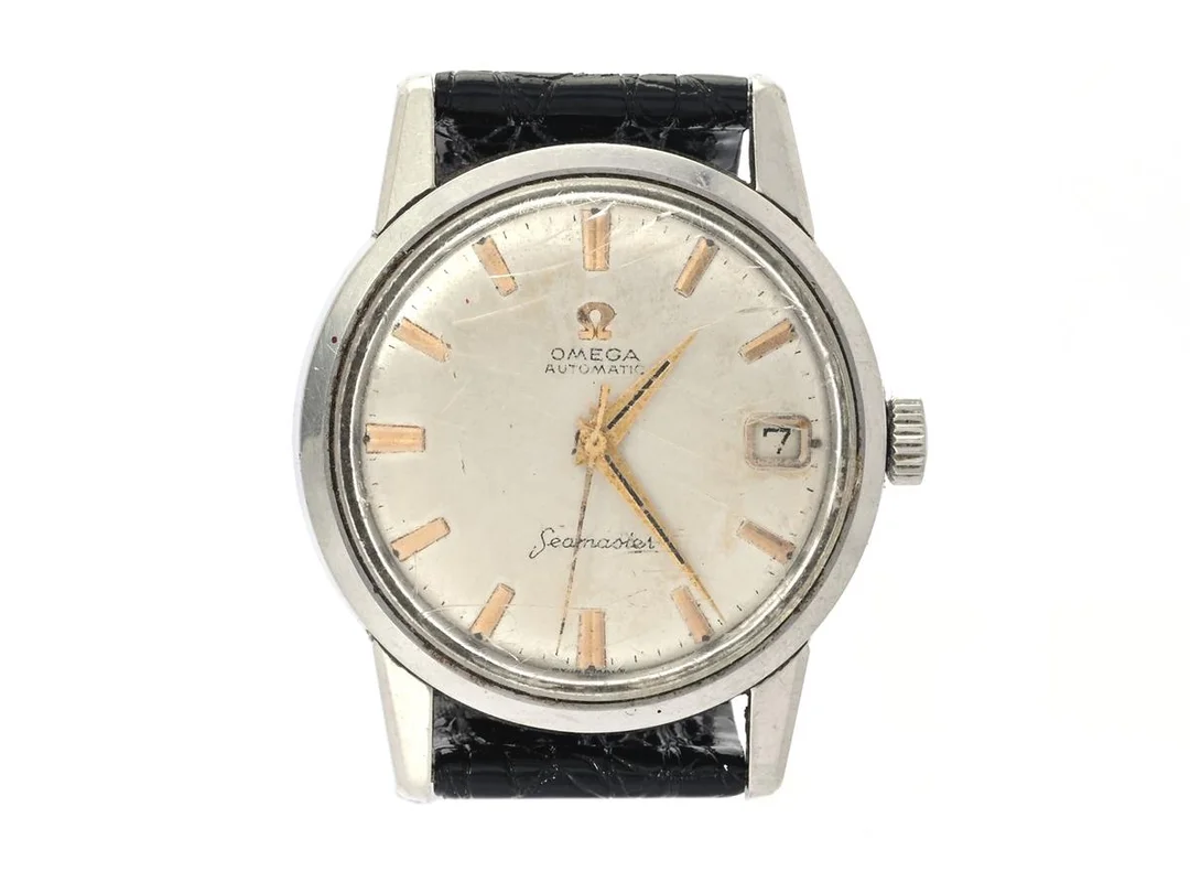 OMEGA, Seamaster, Cal 562, Serie nr. 19680028, Ref nr. CK 14760, Boett nr. 14760 SC-61, herrur, 34 mm, stål, automatisk, plexiglas (skadat), datum (slår ej om rätt), skadad urtavla, defekt, (rost i urverk), läderband, ca 1961. — Klockor/Omega — Kaplans