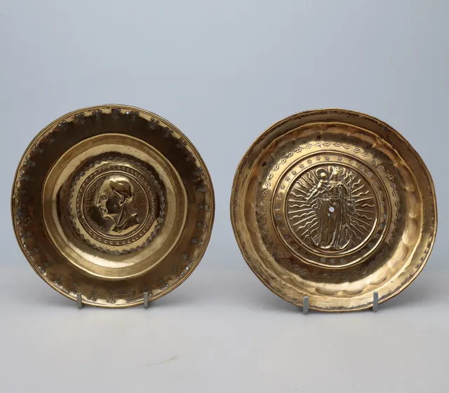 Two charity trays from Dinand or Nuremberg in brass, probably 16th Century.