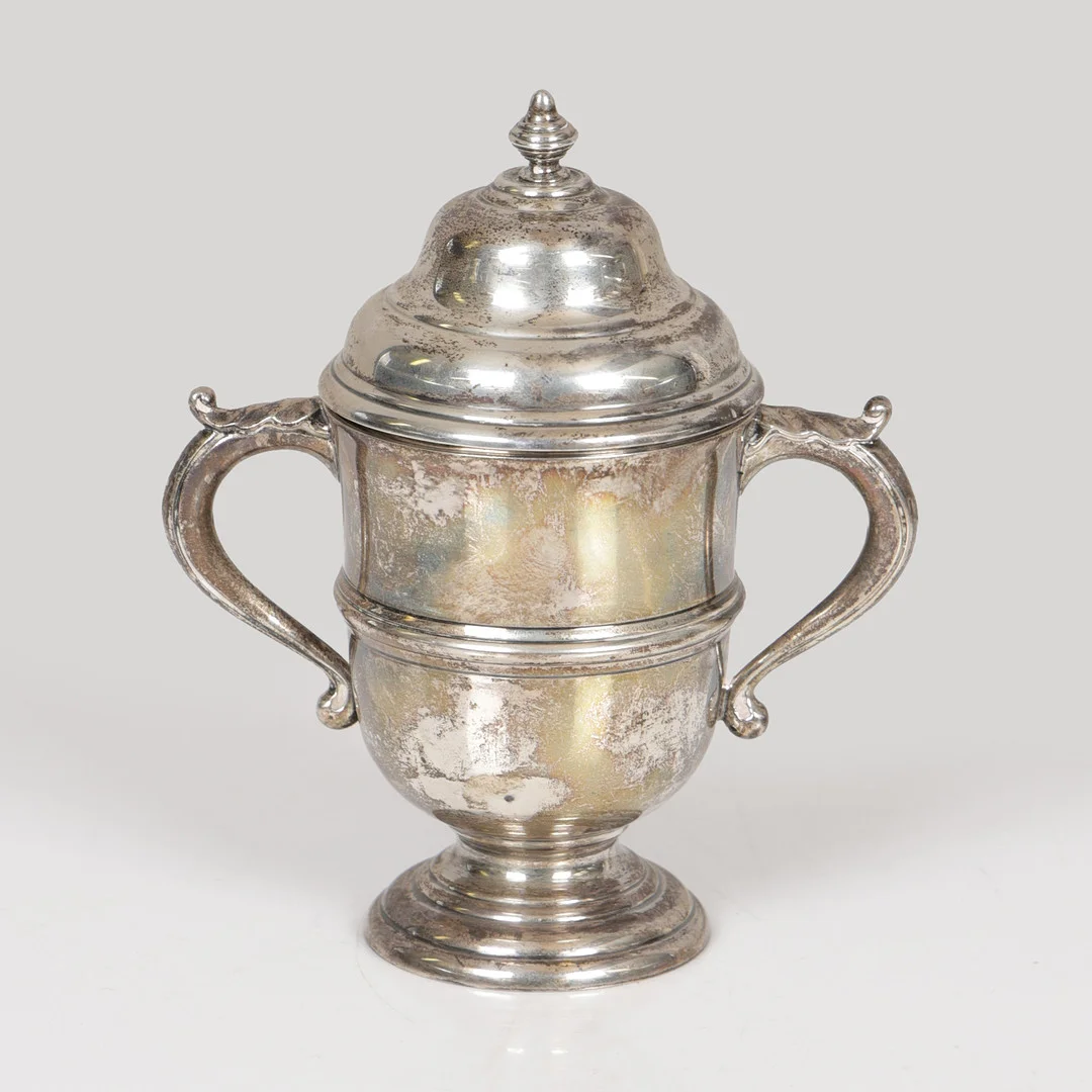 A GEORGE V SILVER TWIN HANDLED CUP AND COVER. — Silver — Bishop & Miller