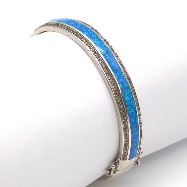 CHRISTIAN&IBANA. VINTAGE ARMREIF STERLING SILBER 925 MIT ZIRKONBESATZ UND OPAL OPTIK INLAY.