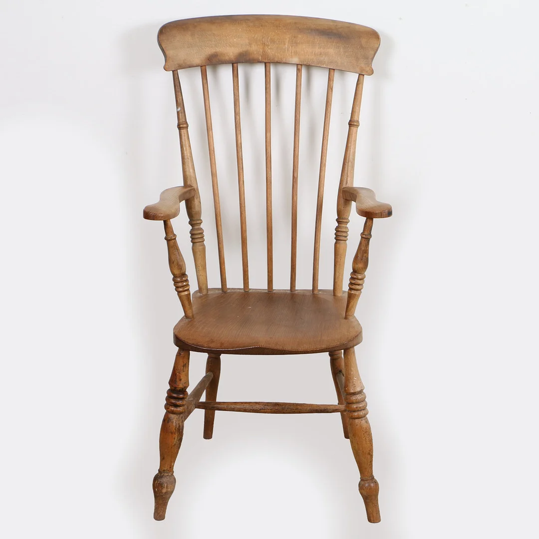 A 20TH CENTURY BEECH AND ELM WINDSOR STYLE ELBOW CHAIR. — Armchairs & Chairs — Bishop & Miller