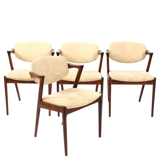 Kai Kristiansen. Set of four armchairs model 42 in rosewood (2)