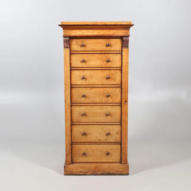A VICTORIAN BIRDS EYE MAPLE WELLINGTON CHEST.