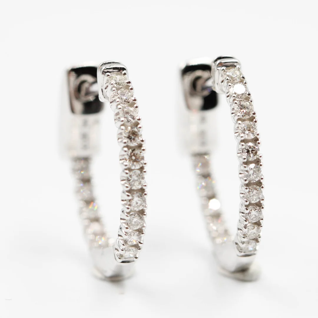 Pair of natural diamond earrings in 14 kt white gold, 0.25 ct (2) — Jewellery/Earrings — Lauritz