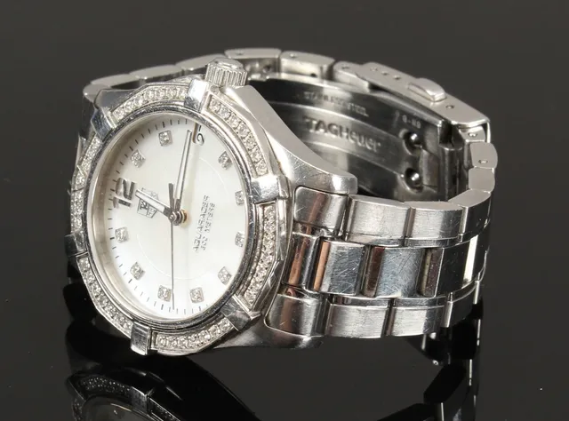 Tag Heuer 'Aquaracer Lady'. Midsize dameur i stål med brillanter og perlemorsskive, 2009
