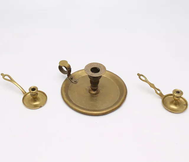 Three brass candlesticks, 20th Century.