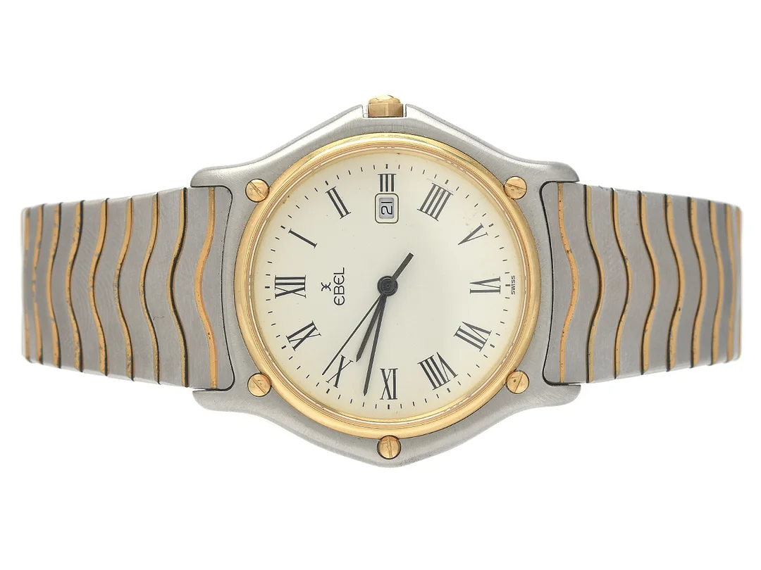 EBEL, Sport Classic, Senior, Serie nr. 14637009, Boett nr. 183903, herrur, 35 mm, stål/guld, quartz, safirglas, datum, skadad urtavla, integrerad originallänk, viklås, cert, juli 1990, box, ytterkartong. — Klockor/Ebel — Kaplans