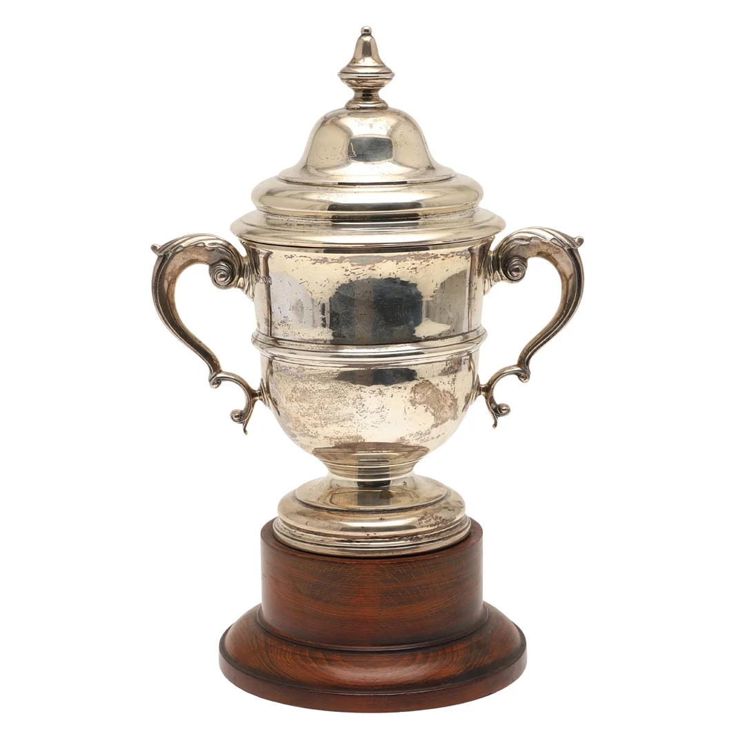 A LATE VICTORIAN LIDDED SILVER TROPHY CUP. — Silver — Lawrences Auctioneers