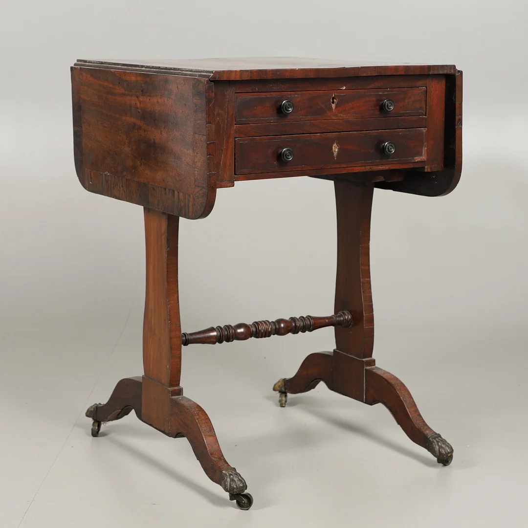 A LATE GEORGE III MAHOGANY AND ROSEWOOD DROP FLAP SEWING TABLE. — Tables — Lawrences Auctioneers