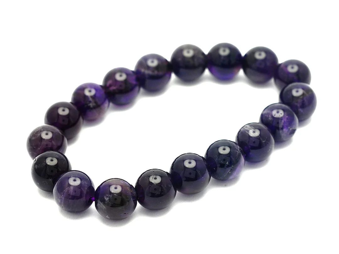 ARMBAND, ametister, ca 10 mm, längd ca 17 cm, elastiskt. — Smycken/Armband — Kaplans