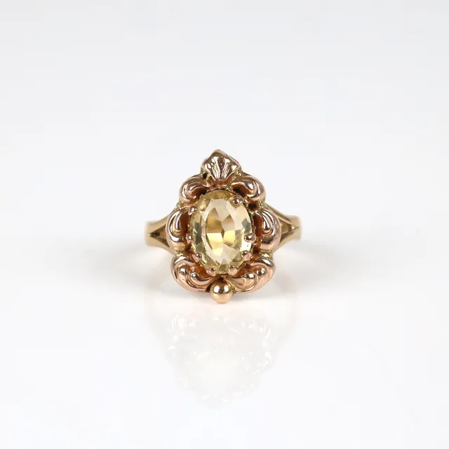 A citrine ring of 14k rose gold and 18k gold. Size 49.