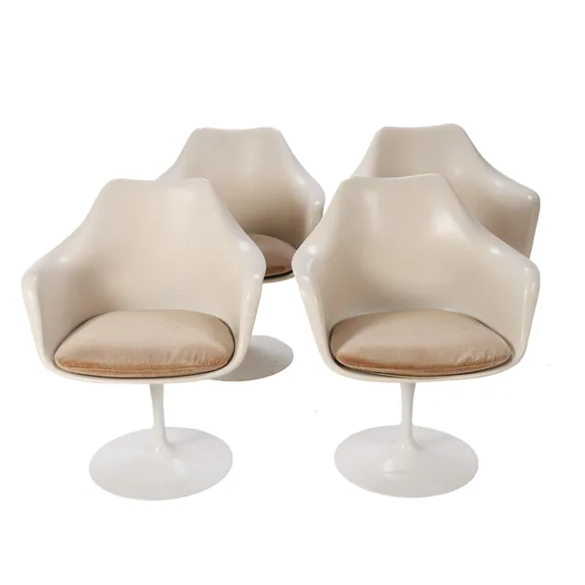 Eero Saarinen for Knoll: A pair of 'Tulip' chairs with shells of white fiberglass-reinforced plastic, original seat cushions upholstered in light plush (faded). Circa 1960-65. (4)