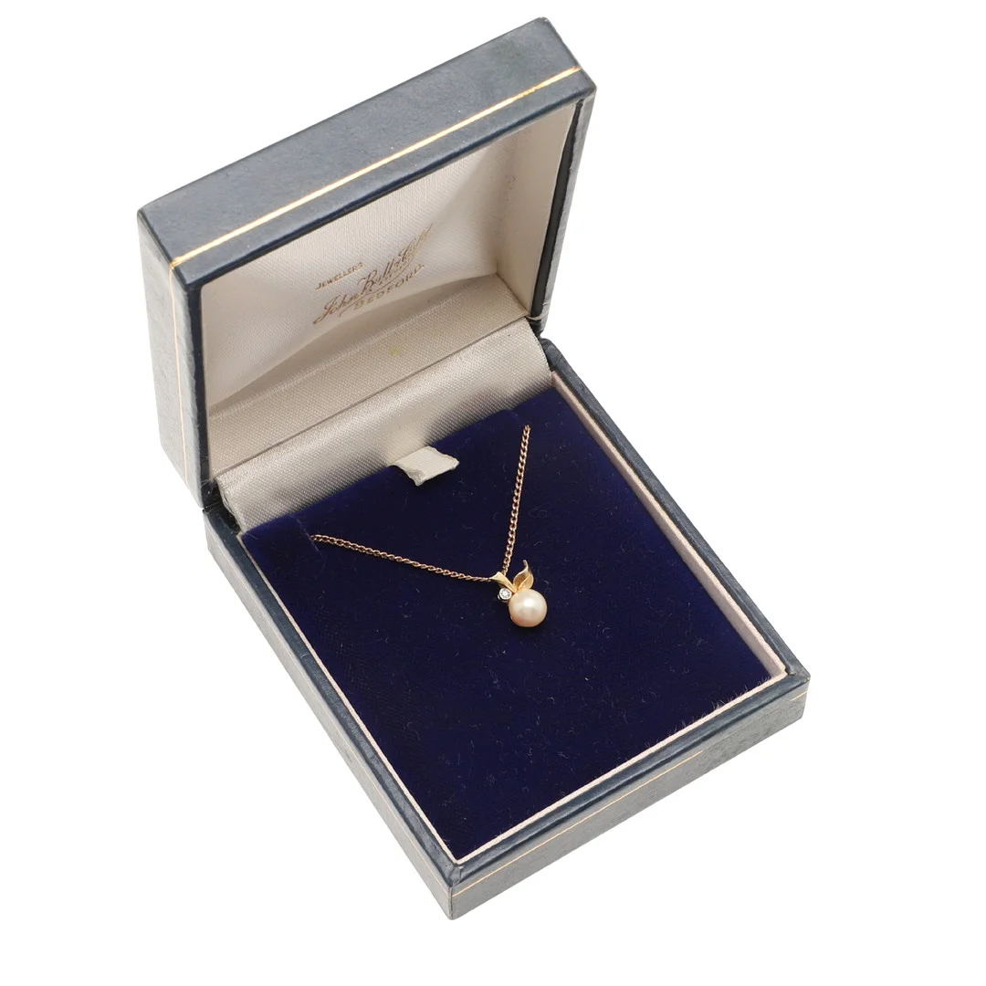 A CULTURED PEARL AND DIAMOND PENDANT. — Brooches & Pendants — Lawrences Auctioneers
