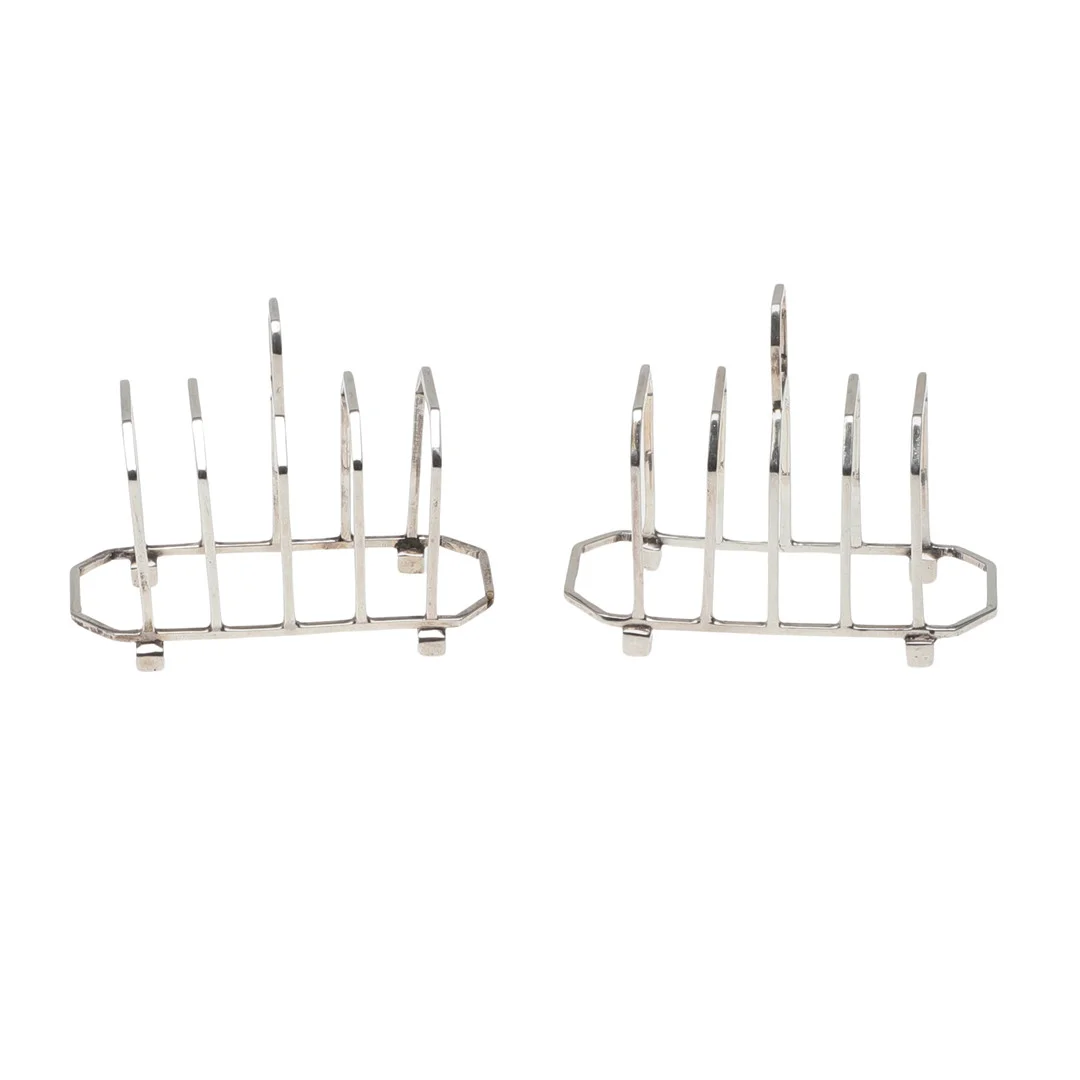 A MATCHED PAIR OF ART DECO SILVER TOAST RACKS. — Silver — Lawrences Auctioneers