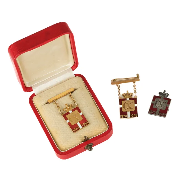 Georg Jensen: Two royal marks of gold, one of silver (2)