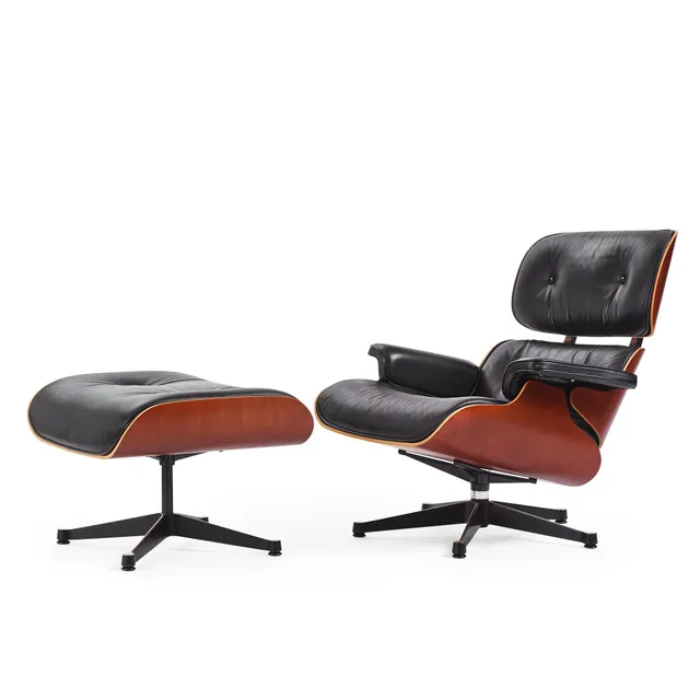 Charles & Ray Eames, fåtölj med fotpall, "Lounge Chair & Ottoman", Vitra, ca 2006.