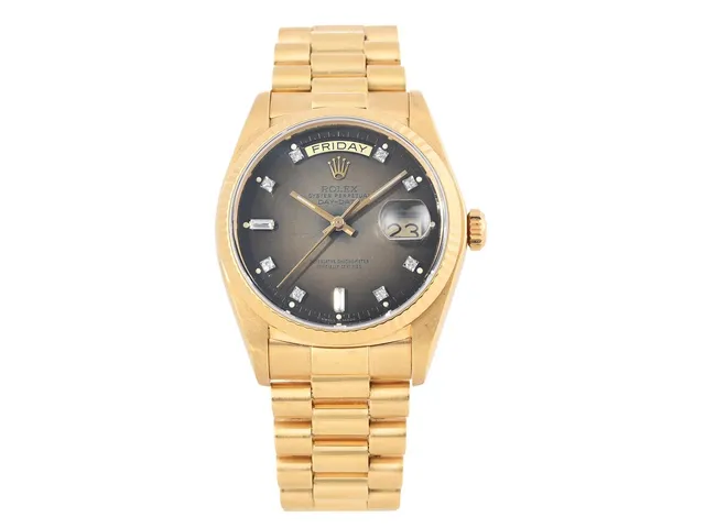 ROLEX, OP, Day-Date (T Swiss Made T), Chronometer, s.k. "Brown Dégradé Diamond / Spider Dial", Ref nr. 18038, Serie nr. 6215763, Cal 3055, Verk nr. 0387053, Boett nr. 18000, herrur, 36 mm, 18K guld, automatisk, safirglas, dag, datum, utbytta visare (Luminova), dia-tavla (8 st. diam + 2 baguetter), Presidentlänk, viklås, Ref nr. 8385-E/55, totalvikt 134,1 gram, ca 1980.