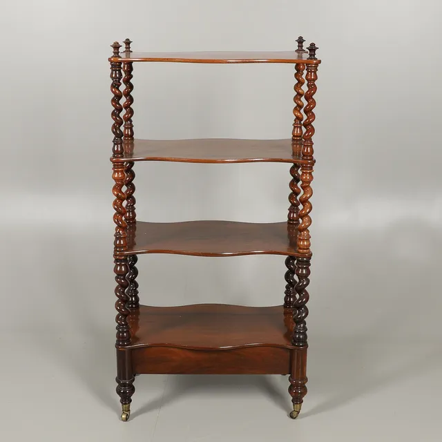 A VICTORIAN ROSEWOOD FOUR TIER WHATNOT.