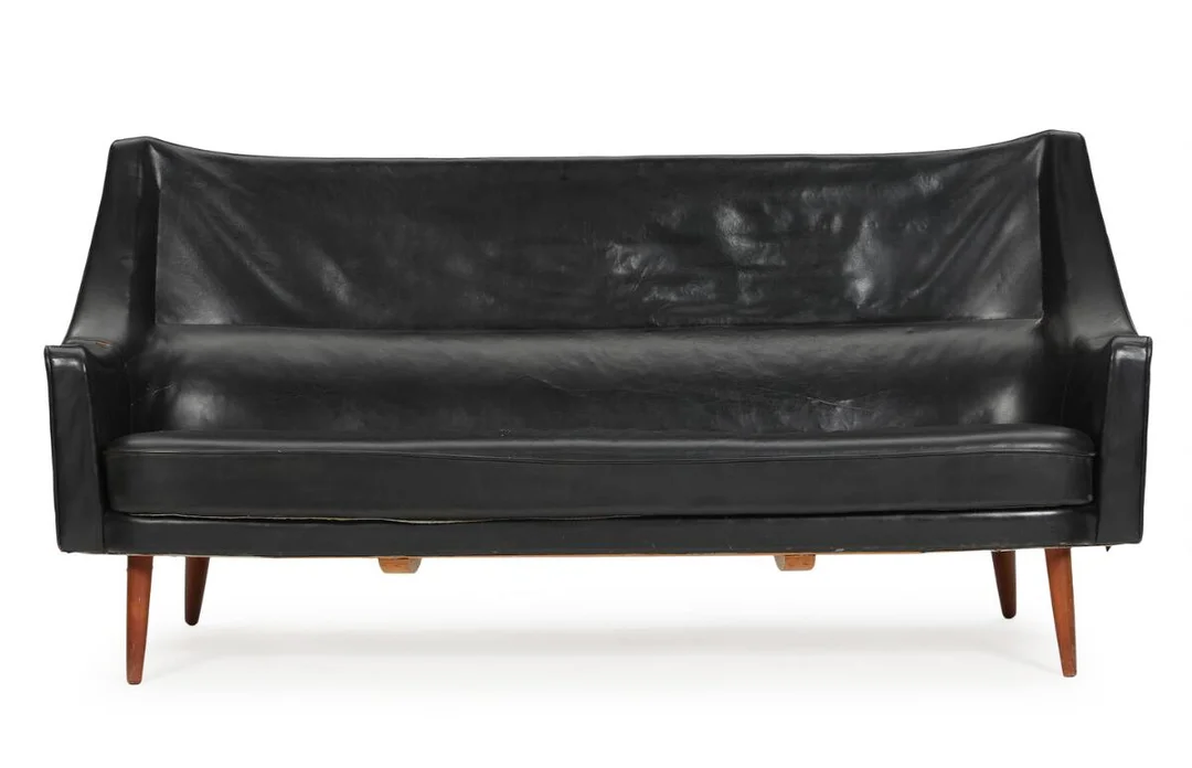 Three-seater sofa with teak legs, upholstered with original black leather. Designed in 1954. Manufactured by Harald Gjernøe or Chr. Sørensen & Co. 1950s. L. 185 cm. — Modern Furniture — Bruun Rasmussen