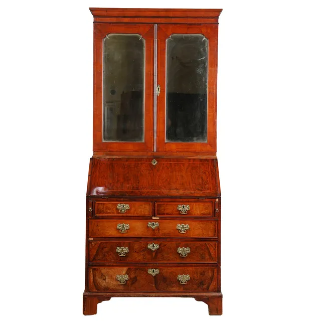 A GEORGE I WALNUT BUREAU BOOKCASE.