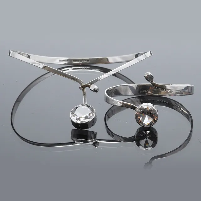 GERT THYSELL. HALSRING SAMT ARMRING, silver och bergkristall, GUSSI, Malmö, 1973 samt 1975.