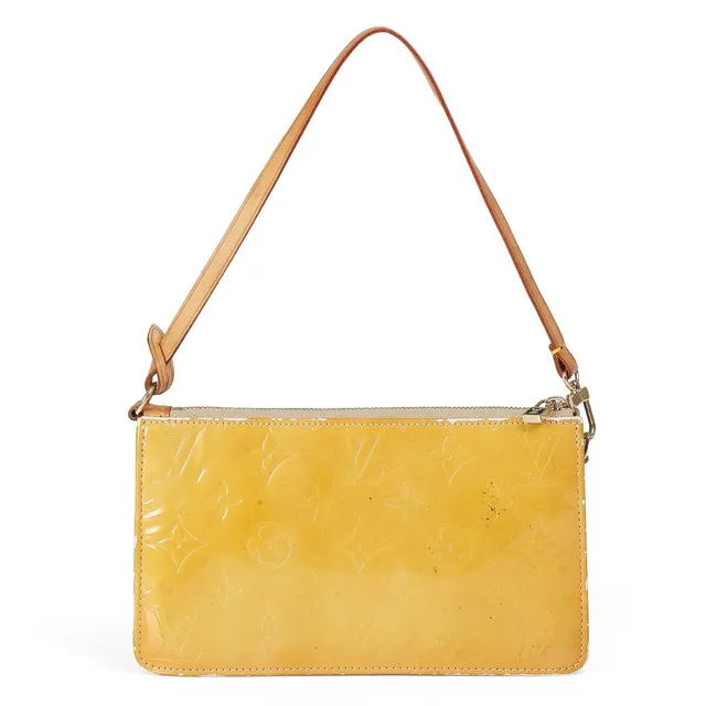 Louis Vuitton: A “Lexington Pouch” of monogram vernis patent leather with brown leather trimmings. 2008.