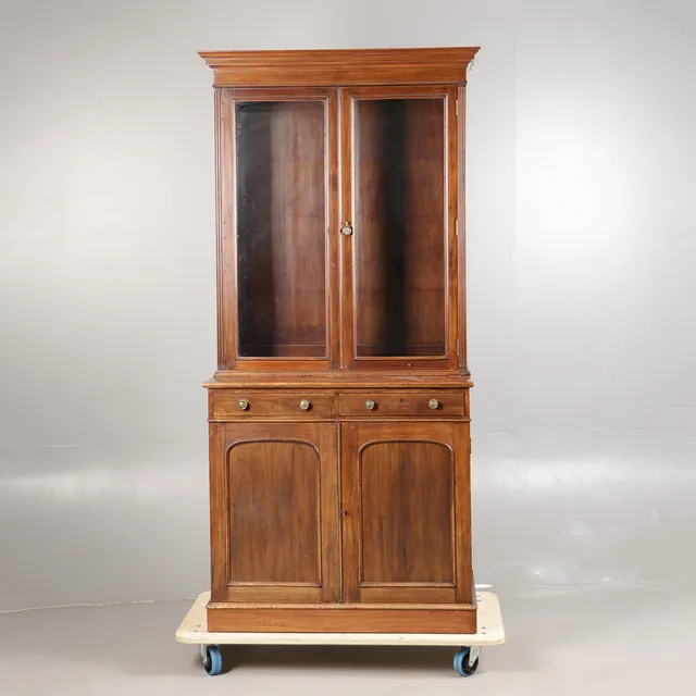 A LATE VICTORIAN MAHOGANY BOOKCASE.