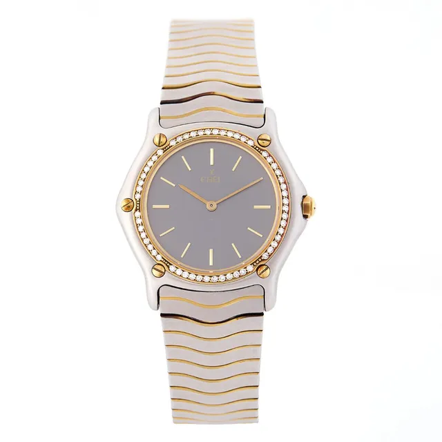 Wristwatch of steel and gold with bezel set with 56 diamonds, ref. 977. Quartz movement, cal. ETA. Circumference approximately 18 cm. Ø 32 mm. 1990s.