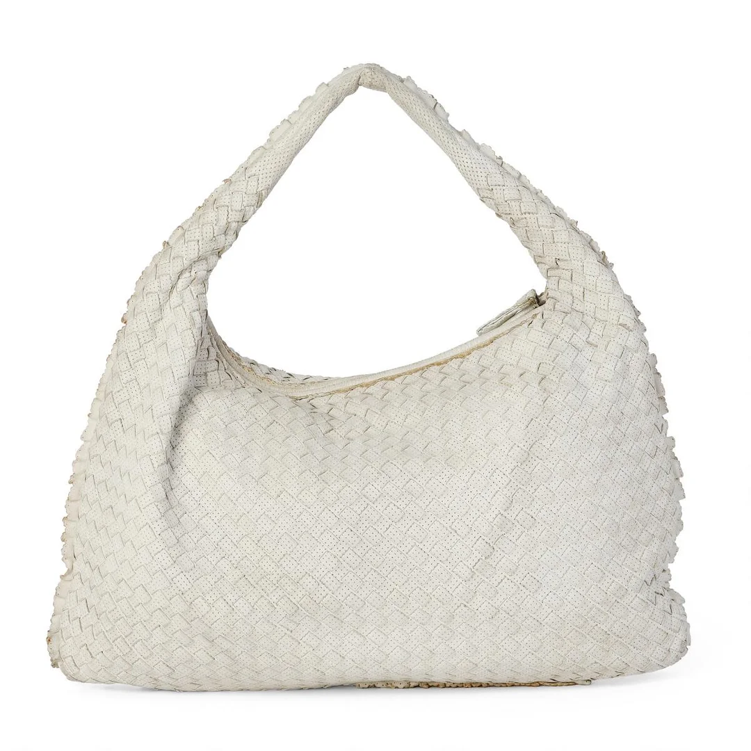 A bag of white woven leather with silver tone hardware, short handle, one zipped compartment with two interior pockets and beige suede lining. H. 30 x W. 45 x D. 5 cm. — Designer Handbags & Fashion/Designer Handbags — Bruun Rasmussen