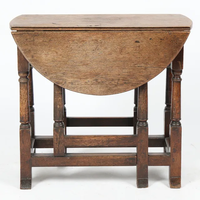 A SMALL CHARLES II OAK GATELEG TABLE, CIRCA 1680.