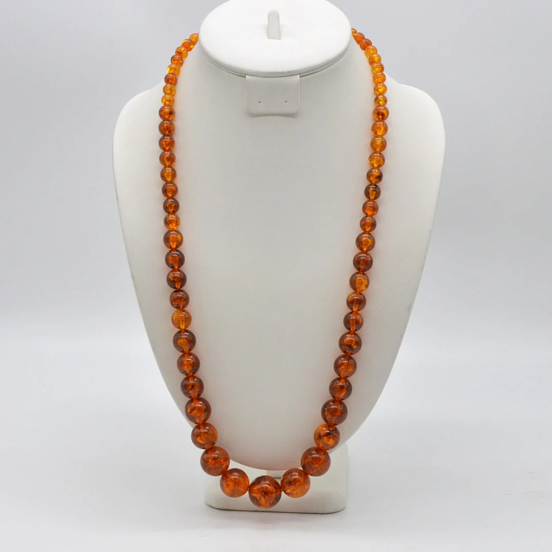 BAKELIT COLLIER, VERGOLDETER VERSCHLUSS, UM 1930ER JAHRE, CA. 74CM. — Necklace — Kunst- und Auktionshaus Kleinhenz