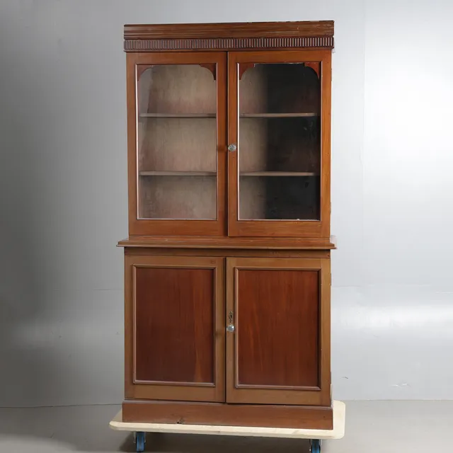 A LATE 19TH CENTURY MAHOGANY BOOKCASE ON CUPBOARD BASE.