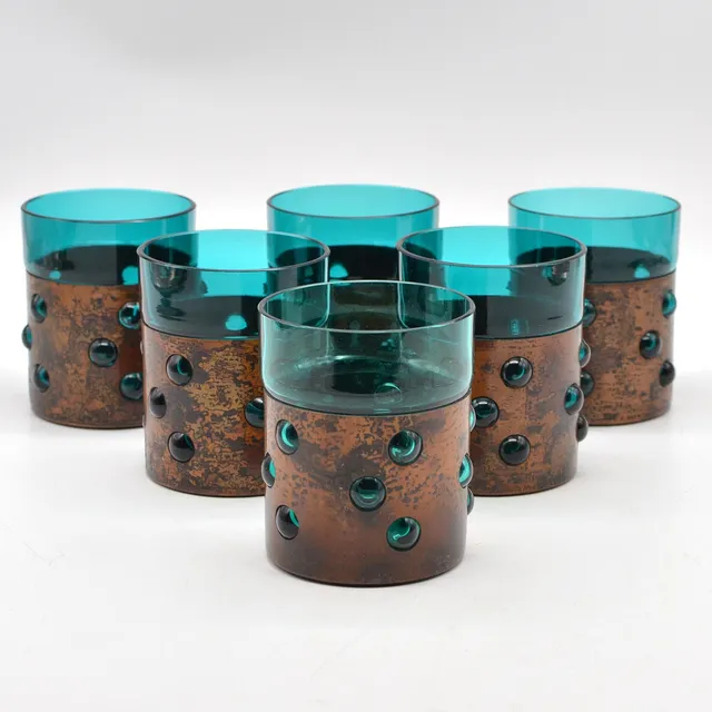 NANNY STILL. SECHS DESIGNERGLÄSER, FÜR RAAK, GLAS UND KUPFER, BRUTALISTISCHES DESIGN, UM 1970ER JAHRE.