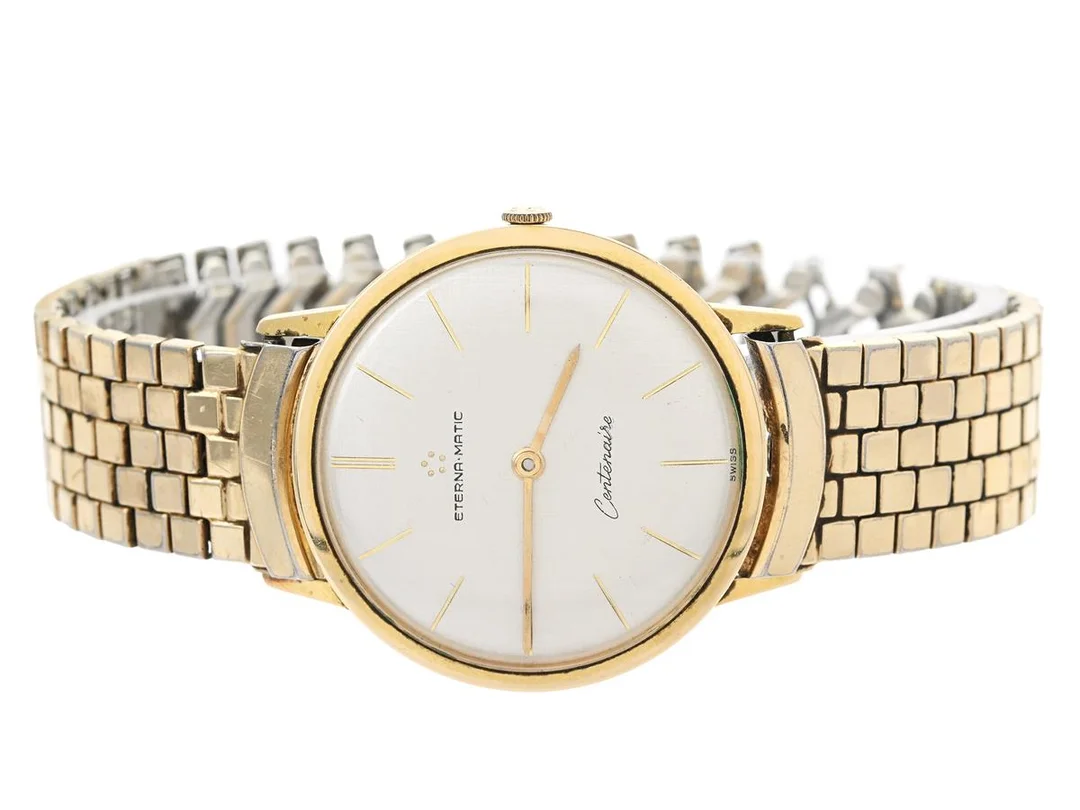 ETERNA-MATIC, Centenaire, Cal 1429U, Serie nr. 4458159, Boett nr. 4392689, herrur, 34,5 mm, doublé (80 micron), automatisk, plexiglas, servicebehov, ca 1960, länk i gulmetall ej original (skadad). — Klockor/Eterna — Kaplans