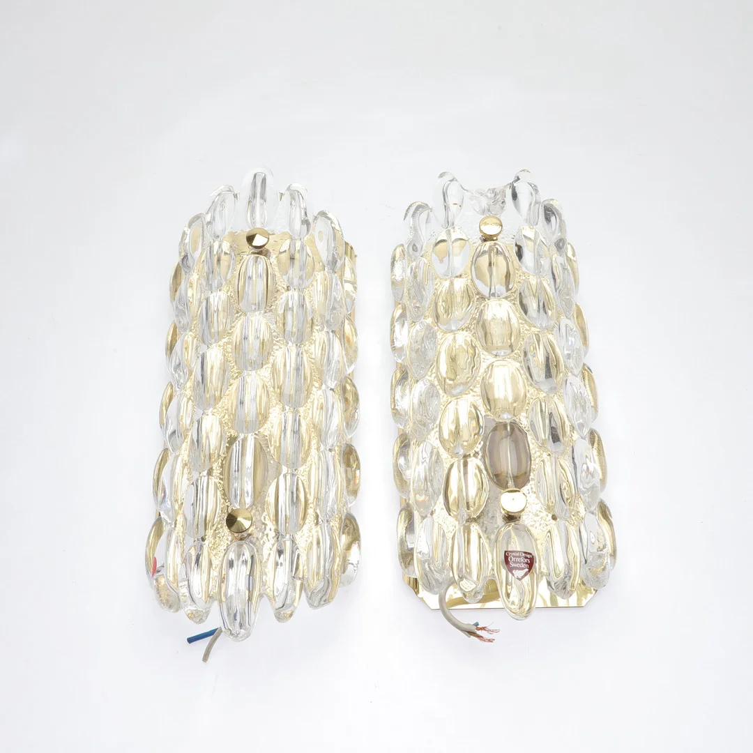 CARL FAGERLUND. vägglampor, 1 par, glas/mässing, Orrefors/Öia, Sverige, 1900-talets andra hälft. — Wall Lights — Gomér & Andersson Norrköping