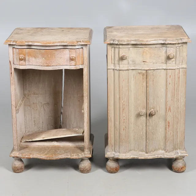 A PAIR OF LIMED OAK BEDSIDE CUPBOARDS.