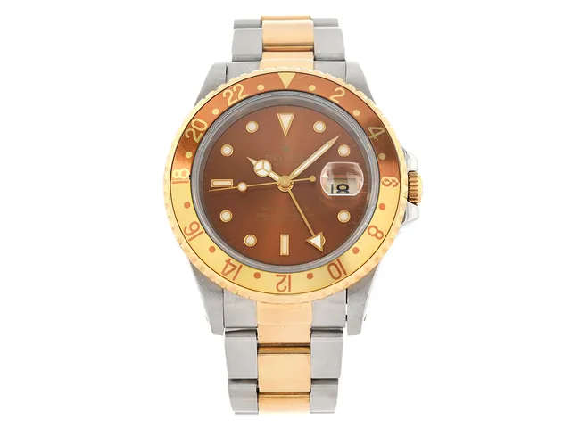 ROLEX, Oyster Perpetual Date, GMT-Master II (Swiss-T<25), Chronometer, s.k. "Root Beer", Ref nr. 16713, Serie nr. U428307, Cal 3185, Verk nr. 3 8023308, Boett nr. 16710, herrur, 40 mm, stål/guld, automatisk, safirglas (nagg), 24-timmarsvisning, (Luminova Dial / Tritium Hands), Oysterlocklänk, viklås, Ref nr. 78793-U2/401 B, cert, oktober 1998, box, ytterkartong.