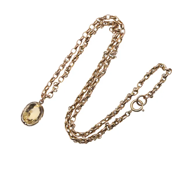 A CITRINE AND GOLD PENDANT.