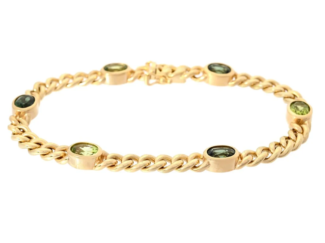 ARMBAND, 18K guld, pansarlänk, ovalslipade gröna turmaliner och peridoter, Italien, längd 19 cm, vikt 25,5 g. — Smycken/Armband — Kaplans